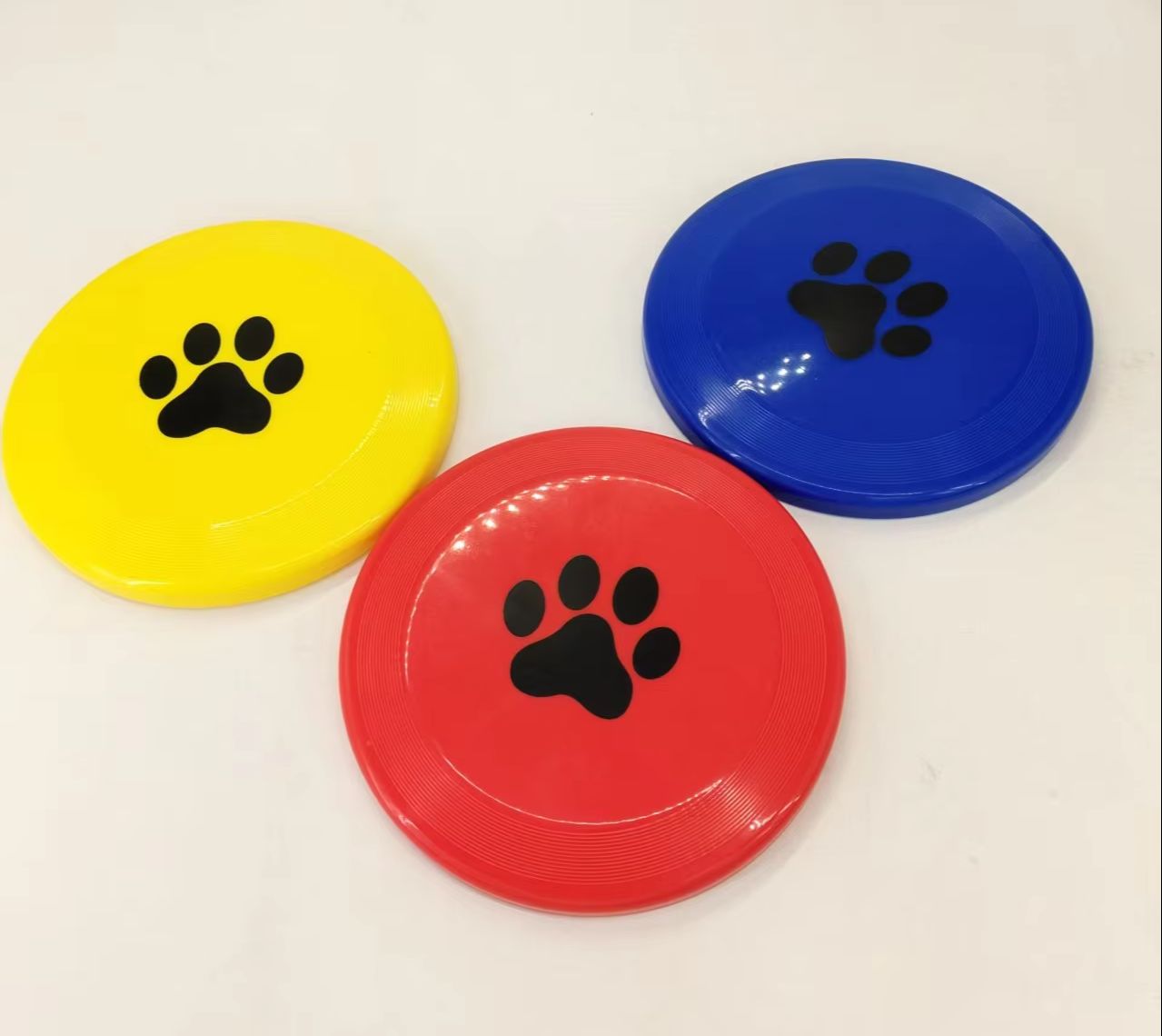 Flying Disc Dog Training Toy - Harte Plastik-Hundefrisbee mit Pfotenabdruck, Rutschfeste Flugscheibe,